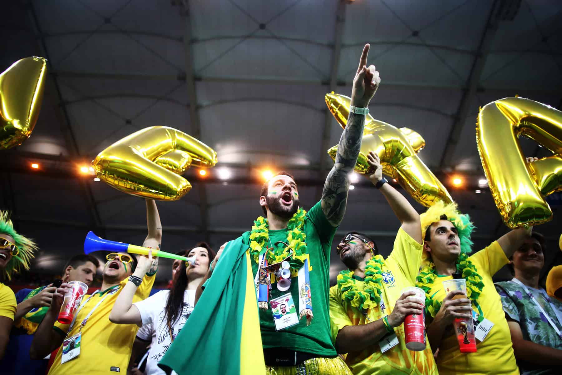 ROSTOV-ON-DON, RUSSIA - JUNE 17:  Brazil fans enjoy the pre match atmosphere prior to the 2018 FIFA World Cup Russia group E match between Brazil and Switzerland at Rostov Arena on June 17, 2018 in Rostov-on-Don, Russia.  (Photo by Lars Baron - FIFA/FIFA via Getty Images)