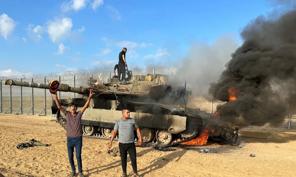 thumbnail-reuters-4-palestinians-react-as-an-israeli-military-vehicle-burns-after-it-was-hit-by-palestinian-gunmen-who-infiltrated-areas-of-southern-israel-at-the-israeli-side-of-israel-gaza thumbnail-reuters-4-palestinians-react-as-an-israeli-military-vehicle-burns-after-it-was-hit-by-palestinian-gunmen-who-infiltrated-areas-of-southern-israel-at-the-israeli-side-of-israel-gaza