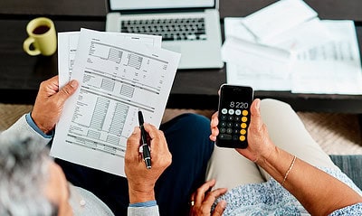We need to make all our numbers balance High angle shot of a couple calculating their finances together at home