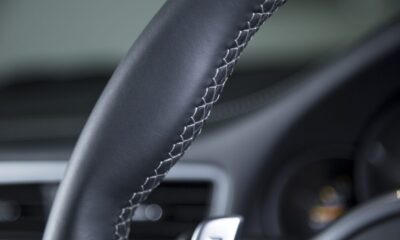 closeup-shot-black-car-s-modern-interior-wheel closeup-shot-black-car-s-modern-interior-wheel