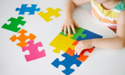 Preschool development of children with autism spectrum disorder. Educational games for special kids. Multicolored Puzzles - Symbol of the World Day of Awareness about Autism