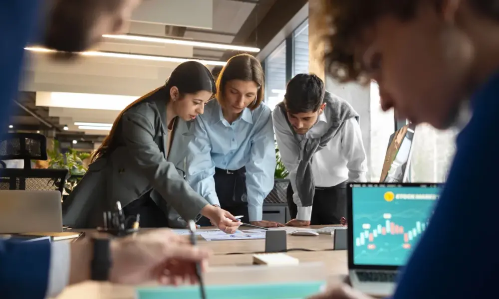 people analyzing checking finance graphs office