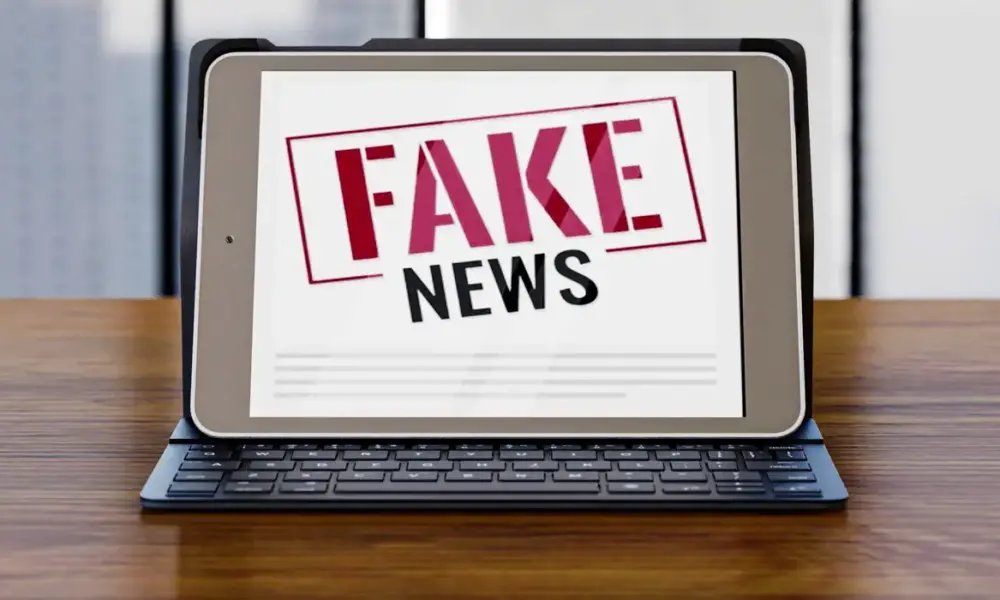 front view laptop desk with fake news 0 front view laptop desk with fake news 0