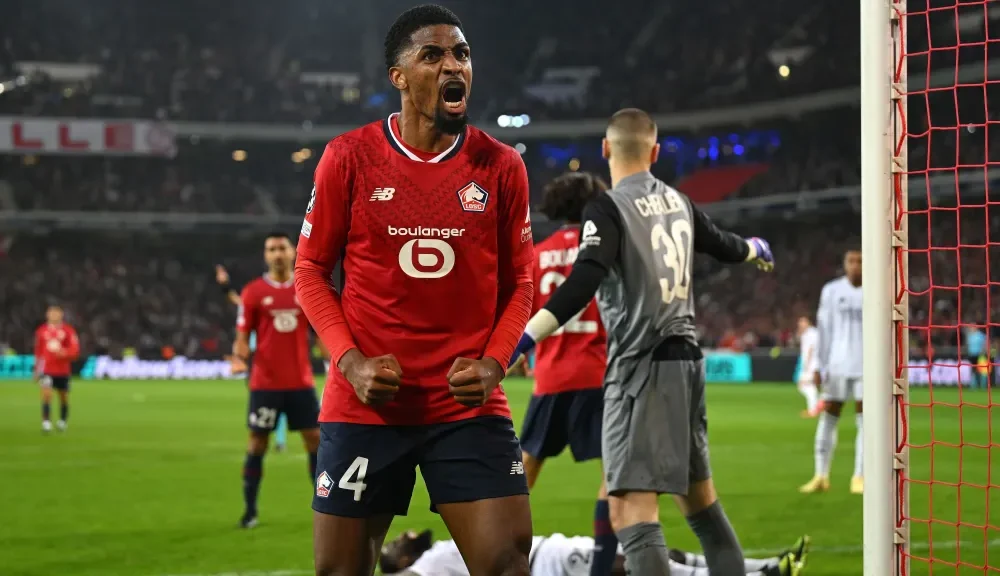 lille-real-madrid-champions-league-e1727904315698 Zagueiro brasileiro Alexsandro comemora a vitória do Lille sobre o Real Madrid • Michael Regan – UEFA/UEFA via Getty Images