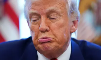 2025-04-09T211527Z_476610592_RC2LUDAC04O9_RTRMADP_3_USA-TRUMP